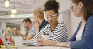 Employees working in team at table