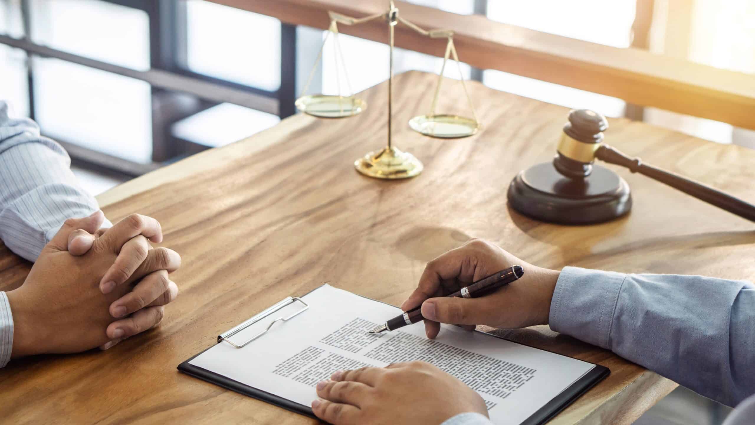 Law, lawyer attorney and justice concept, Consultation between a male lawyer and client, giving advice and prosecutions about the regarding real estate, report of the important case in the workplace.